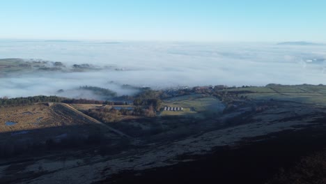 Lancashire-farming-countryside-aerial-cloudy-misty-valley-agricultural-hillside-landscape-pan-right