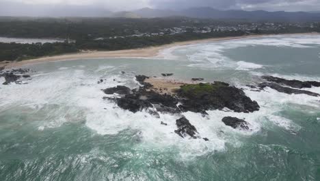 Rocky-Headland-With-Foamy-Breaking-Waves-Overlooking-Township-Of-Sawtell-Beach-In-North-Coast-Of-New-South-Wales,-Australia