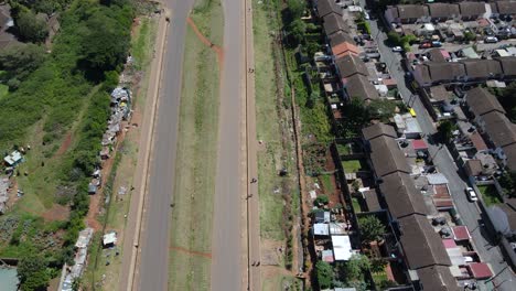 Aerial-view-over-a-highway-street-and-buildings-in-Nairobi,-Kenya