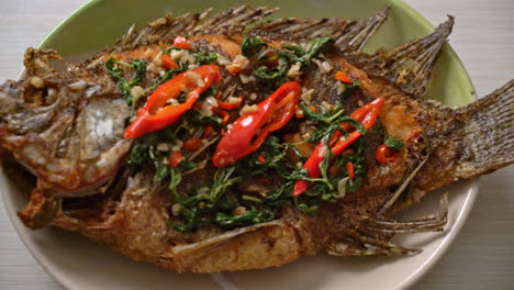 Fried-Tilapia-Fish-with-Basil-chili-garlic-sauce-on-top---homemade-food-style
