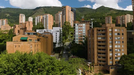 Establishing-Aerial-Shot-of-Affluent-South-American-Neighborhood-with-Mountains-in-Background