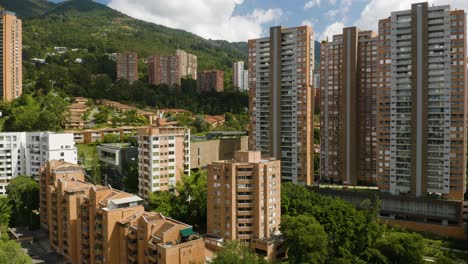 Establishing-Drone-Shot-Passing-Apartment-Buildings-in-Medellin,-Colombia-on-Sunny-Day