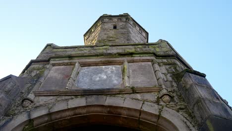Looking-up-Darwen-Jubilee-tower-historic-landmark-Lancashire-building-architecture-slow-right-dolly