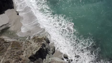 Californian-Big-Sur-rugged-coastline,-waves-crashing-against-shoreline,-aerial