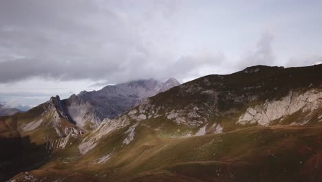 Woman-is-hiking-in-the-Alps---Parallax-drone-flight