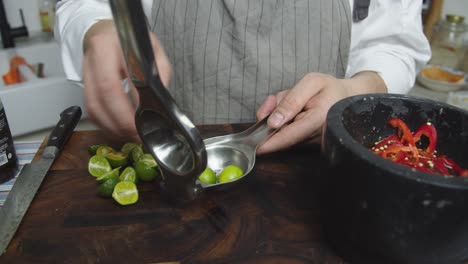 Squeezing-lime-juice-into-the-black-bowl