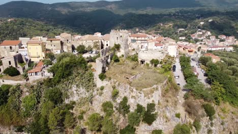 Aerial-view-over-Camerota-village-on-top-of-a-cliff-on-the-Apennine-mountains,-Italy