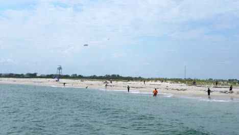 People-enjoying-the-beach-and-fishing-at-the-Barnegat-light-in-New-Jersey