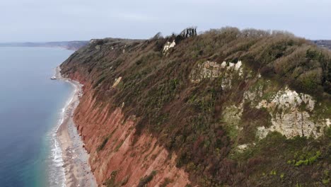 Forward-aerial-shot-of-the-cliffs-at-Branscombe-looking-towards-Sidmouth-Devon-England-UK