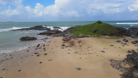 Flying-Above-Rocky-Shore-At-Sawtell-Beach