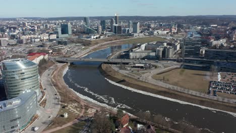 AERIAL:-Flying-Over-River-Neris-Towards-Roundabout-in-Vilnius