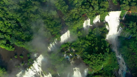 Aerial---Iguazu-Falls-and-jungle-in-Misiones,-Argentina,-wide-overhead-shot