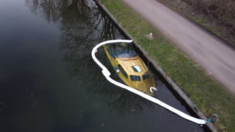 Aerial-view-of-sunken-motorboat-Sticking-Out-Of-Sea-Water