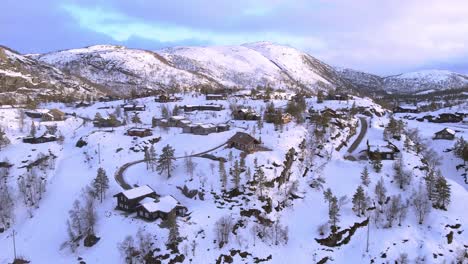 Norwegian-panorama-Drone-shot-of-Norwegian-cabins-next-to-ski-resort