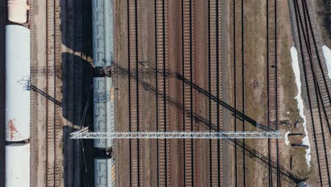 AERIAL:-Top-Down-View-of-Empty-Cargo-Train-Parked-on-Train-Rails
