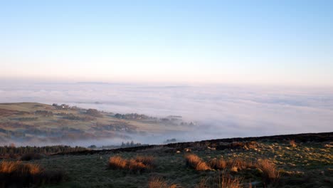 Fog-clouds-passing-Lancashire-countryside-moorland-valley-viewpoint-at-sunrise