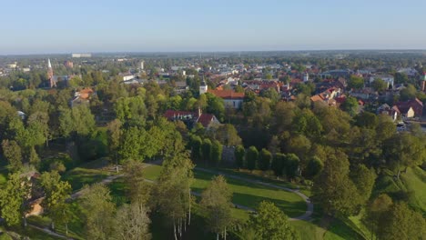 Drone-moving-right-from-Estonia,-Viljandi-with-oldtown-buildings