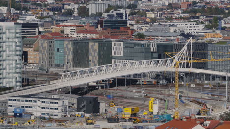 Train-moving-into-Oslo-central-station,-seen-from-afar
