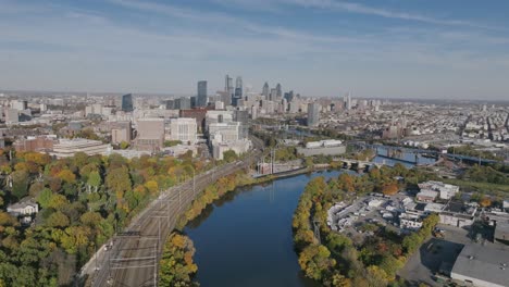 Aerial-footage-in-autumn-showing-the-Schuylkill-River-meandering-towards-downtown-Philadelphia-in-the-afternoon
