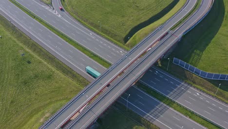 Highway-overpass-with-traffic-in-day,-trucks-and-cars
