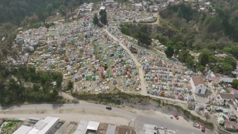 Aerial-top-down-footage-that-gimbals-towards-a-colorful-cemetery-in-Chichicastenango,-Guatemala