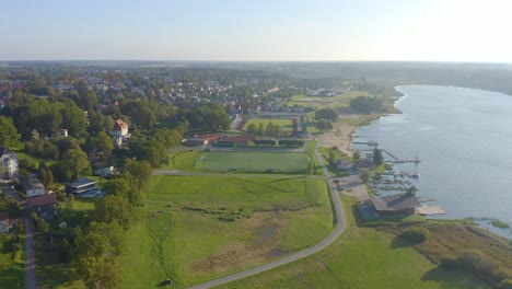 Beautiful-drone-of-Viljandi,-Estonia-in-summer-with-harbor-and-boats