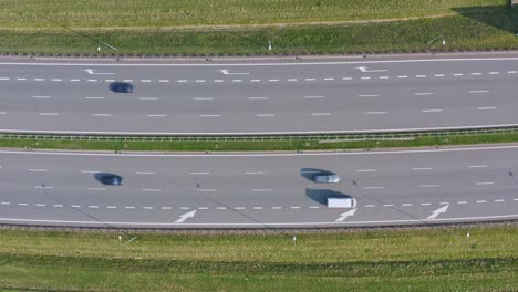 Traffic-flow-in-opposite-directions-on-highway---aerial-top-down-view