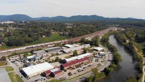 4K-Aerial-Drone-Video-of-French-Broad-River-and-Norfolk-Southern-Train-Yard-in-Asheville,-NC