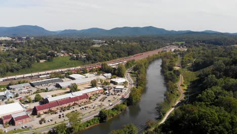 4K-Aerial-Drone-Video-of-French-Broad-River,-Train-Yard-and-River-Arts-District-in-Asheville,-NC