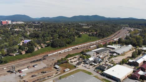 4K-Aerial-Drone-Video-of-French-Broad-River-and-Norfolk-Southern-Train-Yard-in-Asheville,-NC