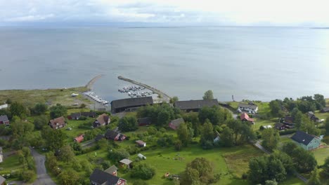 Awesome-drone-of-an-Estonian-village-by-the-sea-with-a-small-harbor-and-boats
