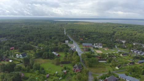 Forward-moving-drone-of-an-Estonian-village-by-the-sea