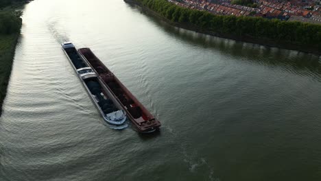 Cargo-ship-with-coal-bulk-load-on-the-Binnen-Merwede-river-in-Sliedrecht,-Netherlands