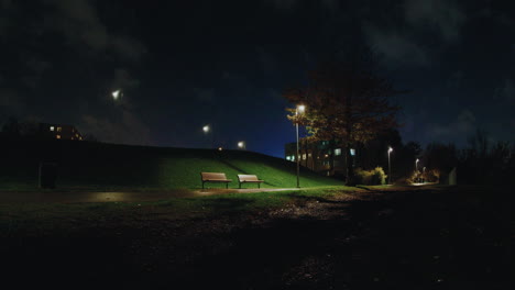 Sitting-bench-inside-Pae-park-at-night,-Tallinn,-Estonia
