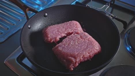 Chef-Puts-Raw-Ground-Turkey-Meat-Into-Pan-Greased-With-Oil-For-Cooking