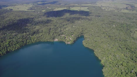 Aerial-View-Of-Volcanic-Lake-Eacham-In-North-Queensland,-Australia---drone-shot