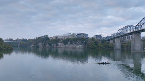 Aerial-footage-going-backwards-of-the-Hunter-Museum-revealing-rowing-boats-on-the-Tennessee-River-in-Chattanooga-Tennessee-on-a-cloudy-day