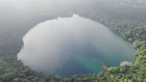 Lake-Eacham-Through-Clouds-Surrounded-By-Lush-Rainforest-In-Atherton-Tablelands-Of-Queensland