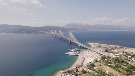 Aerial-view-around-the-Rion–Antirion-Bridge-in-Patras,-in-sunny-Greece---circling,-drone-shot