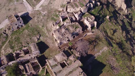 Above-historically-destroyed-stone-village-Craco-in-Italy,-broken-by-landslide