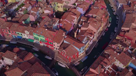 Above-touristic-Burano-village-in-Venitian-lagoon,-colorful-houses,-aerial