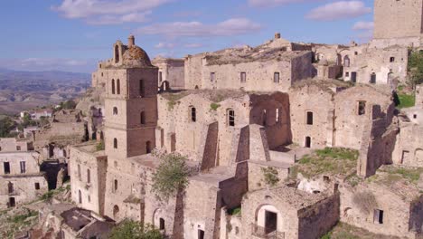 Abandoned-ghost-town-Craco-with-church-tower,-filming-location,-aerial