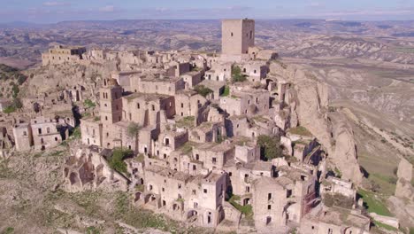 Craco-ghost-town-on-top-of-hill-in-Italy,-aerial