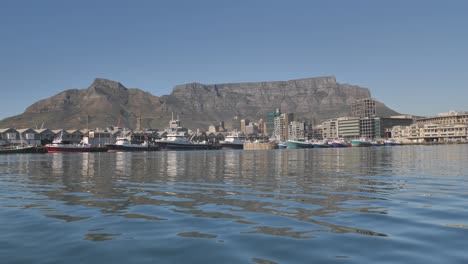 Table-Mountain-from-the-harbour-with-boats,-buildings-and-industry