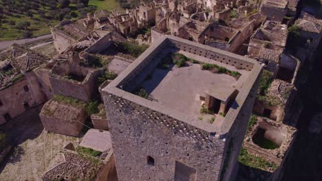 Normanna-Tower-at-Craco-historic-town-reclaimed-by-nature,-aerial