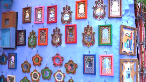 A-blue-wall-in-the-blue-city-of-Chefchaouen-full-of-mirrors,-Morocco