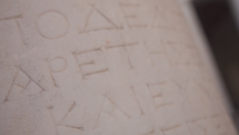 Close-up-of-ancient-ruins-in-Greece,-ancient-greek-writing-and-symbols