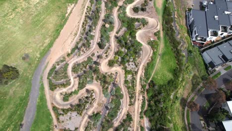Suburban-mountain-bike-trails-aerial-in-Quarry-Park,-Melbourne
