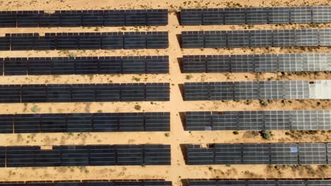 Drone's-perspective-of-solar-farm-in-Utah's-desert-region