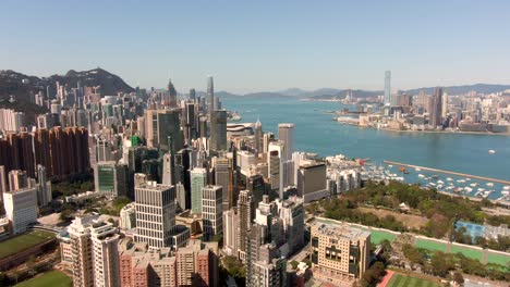 Central-Hong-Kong-bay-and-city-skyscrapers,-Aerial-footage